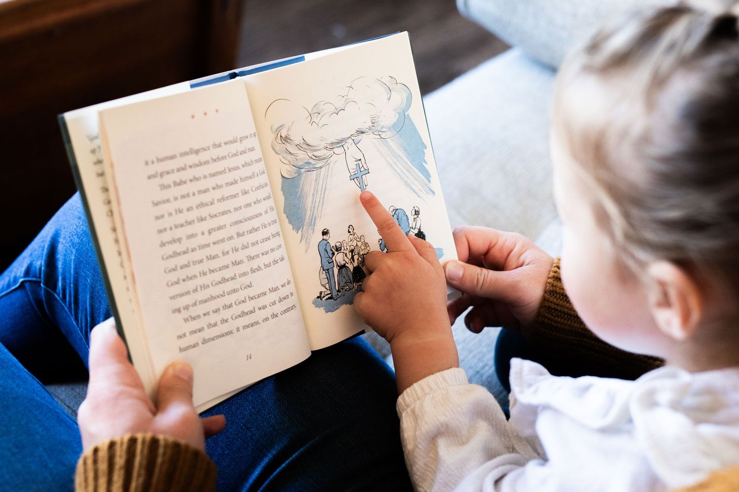 Students reading and following along in a children's book during a classroom storytime session.