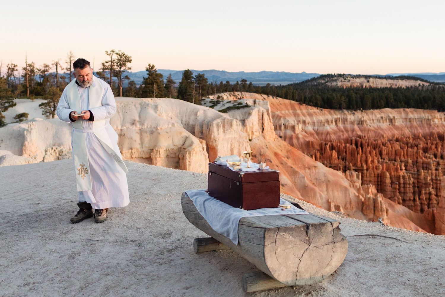 A series of photos showing a couple enjoying sunset views at the majestic red rock formations of Bryce Canyon National Park.
