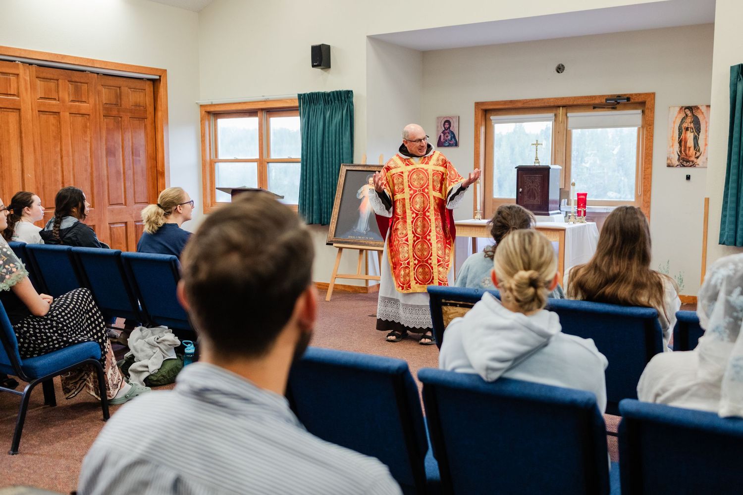 Students sit attentively in a classroom during an academic presentation or lecture.