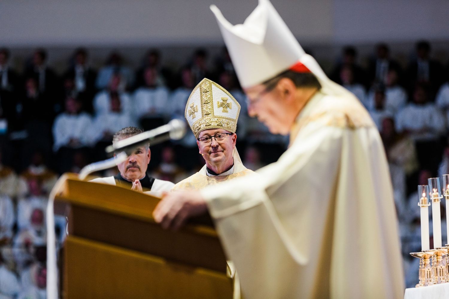 A series of photos showing a Catholic bishop wearing a miter and vestments during a religious ceremony.
