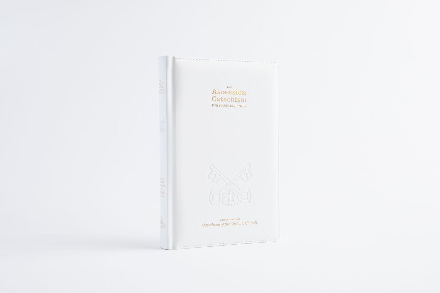 White hardcover book with gold foil text and elegant minimalist design displayed against a white background.