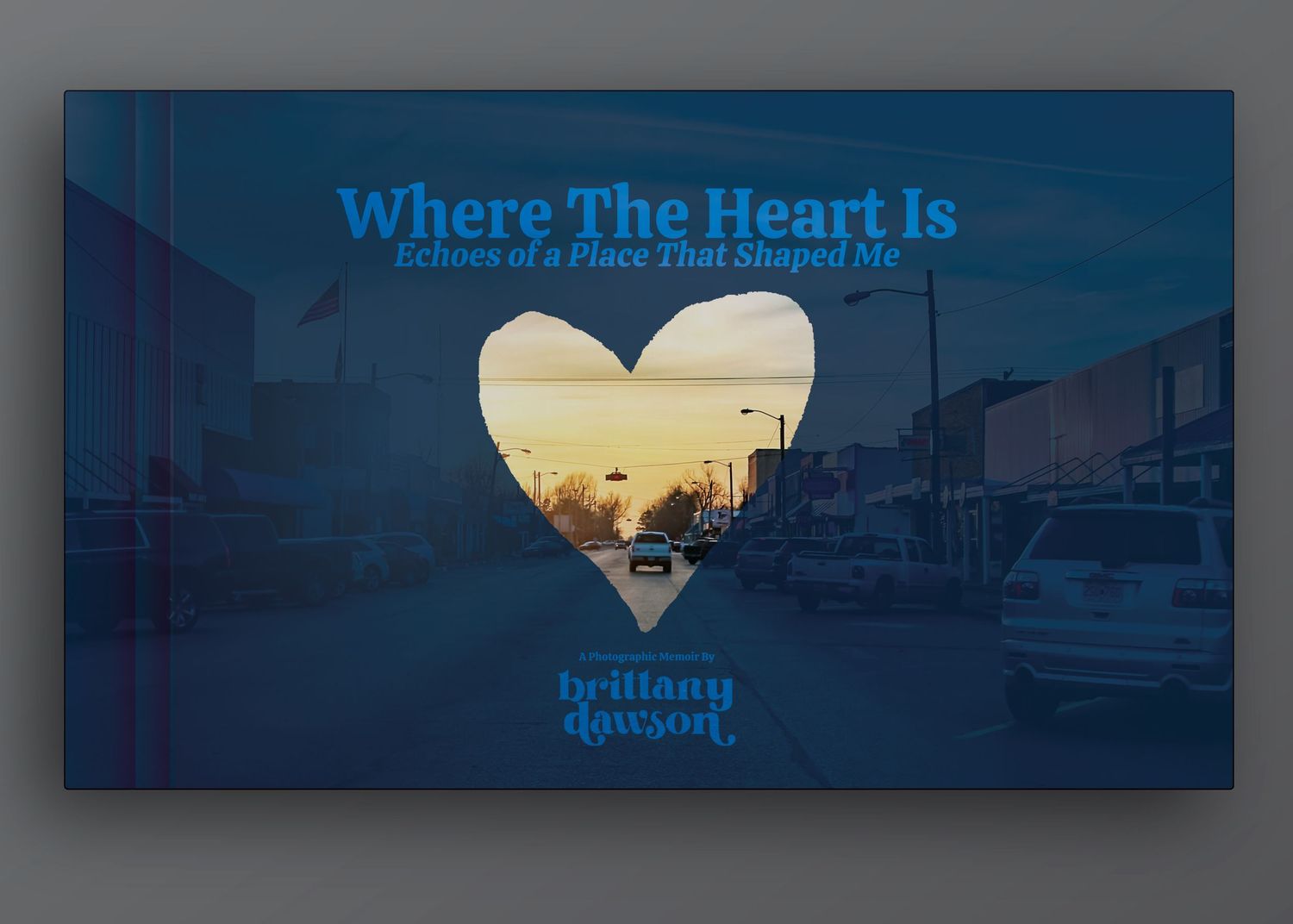 Sunset cityscape viewed through a heart-shaped window with 'Where The Heart Is' text overlay.
