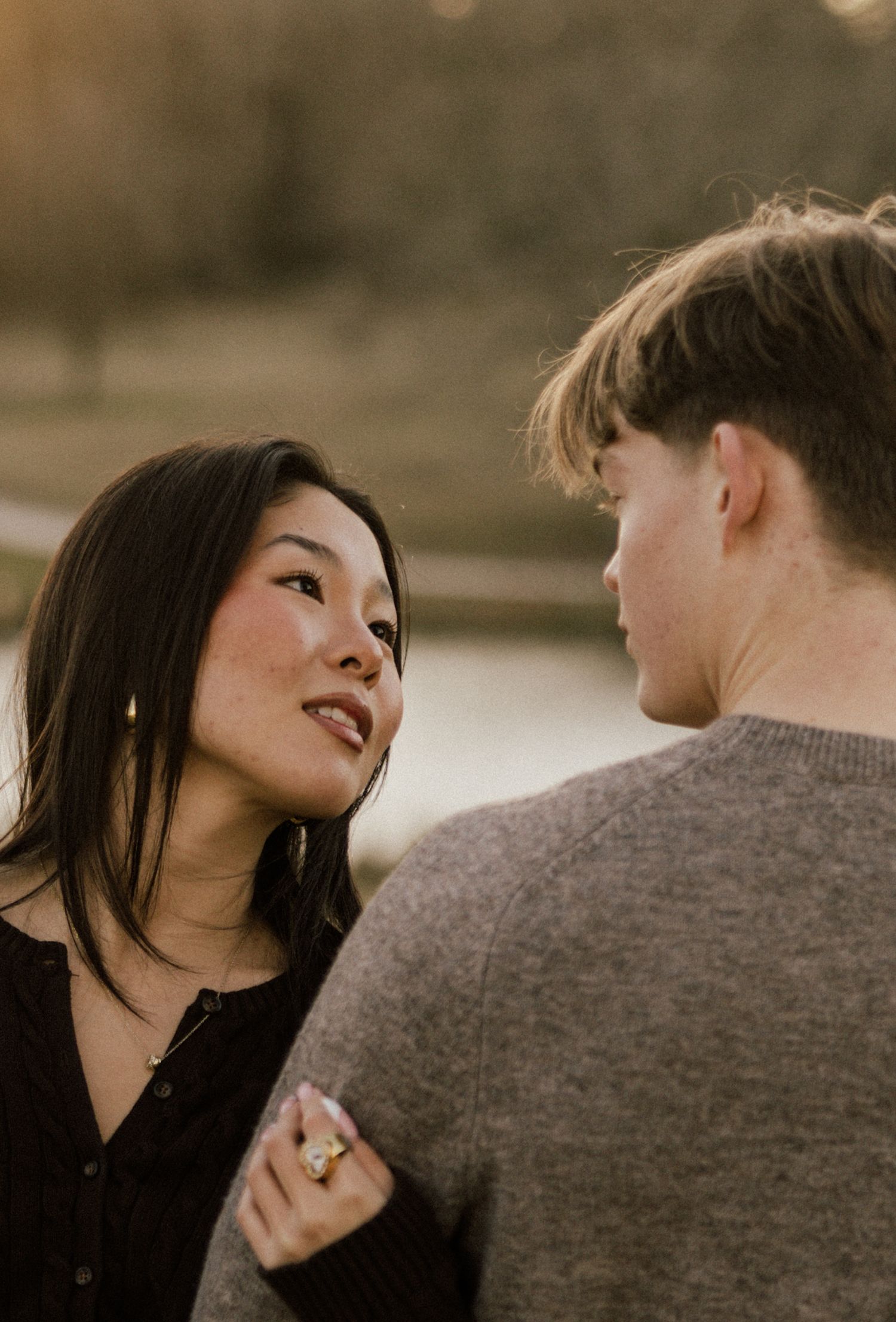 A romantic couple sharing playful moments in a series of intimate outdoor photographs at sunset.