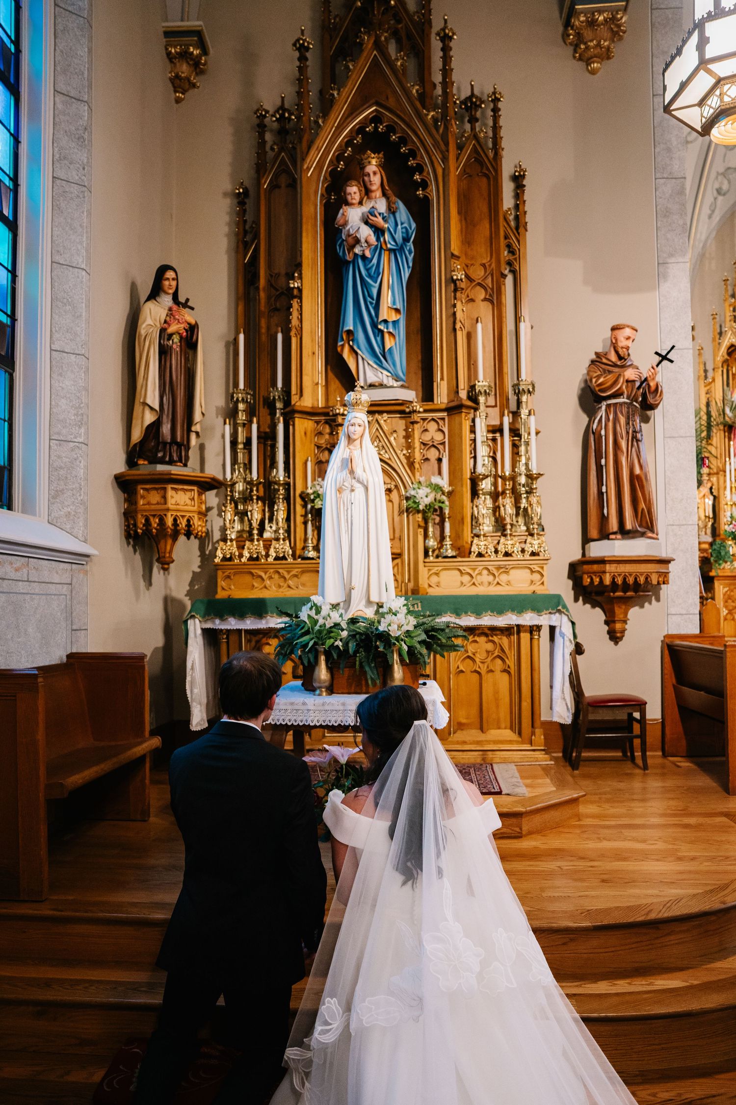 A sequence of wedding ceremony photos inside an ornate Catholic church with gothic architecture and religious statues.