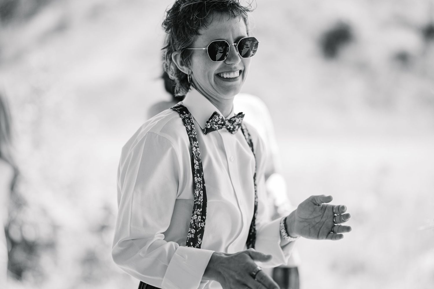 A black and white photo collage shows a person in sunglasses and a white shirt against blurred backgrounds.