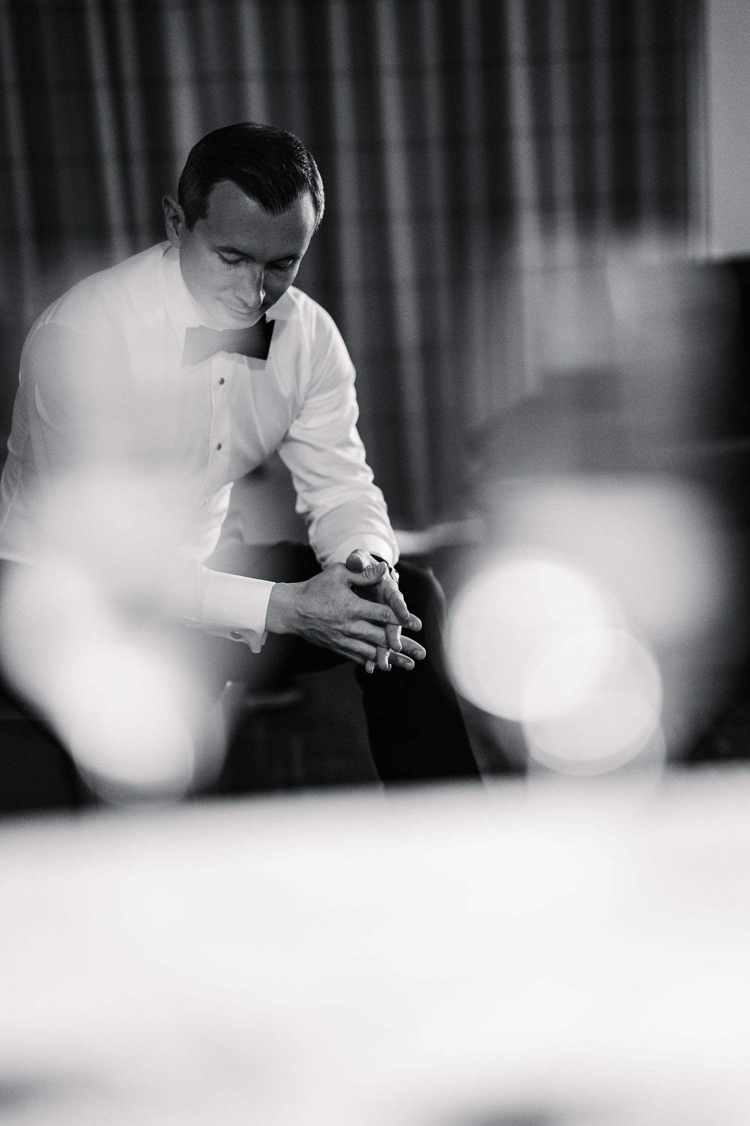 Black and white sequence showing hands preparing food in a professional kitchen setting.