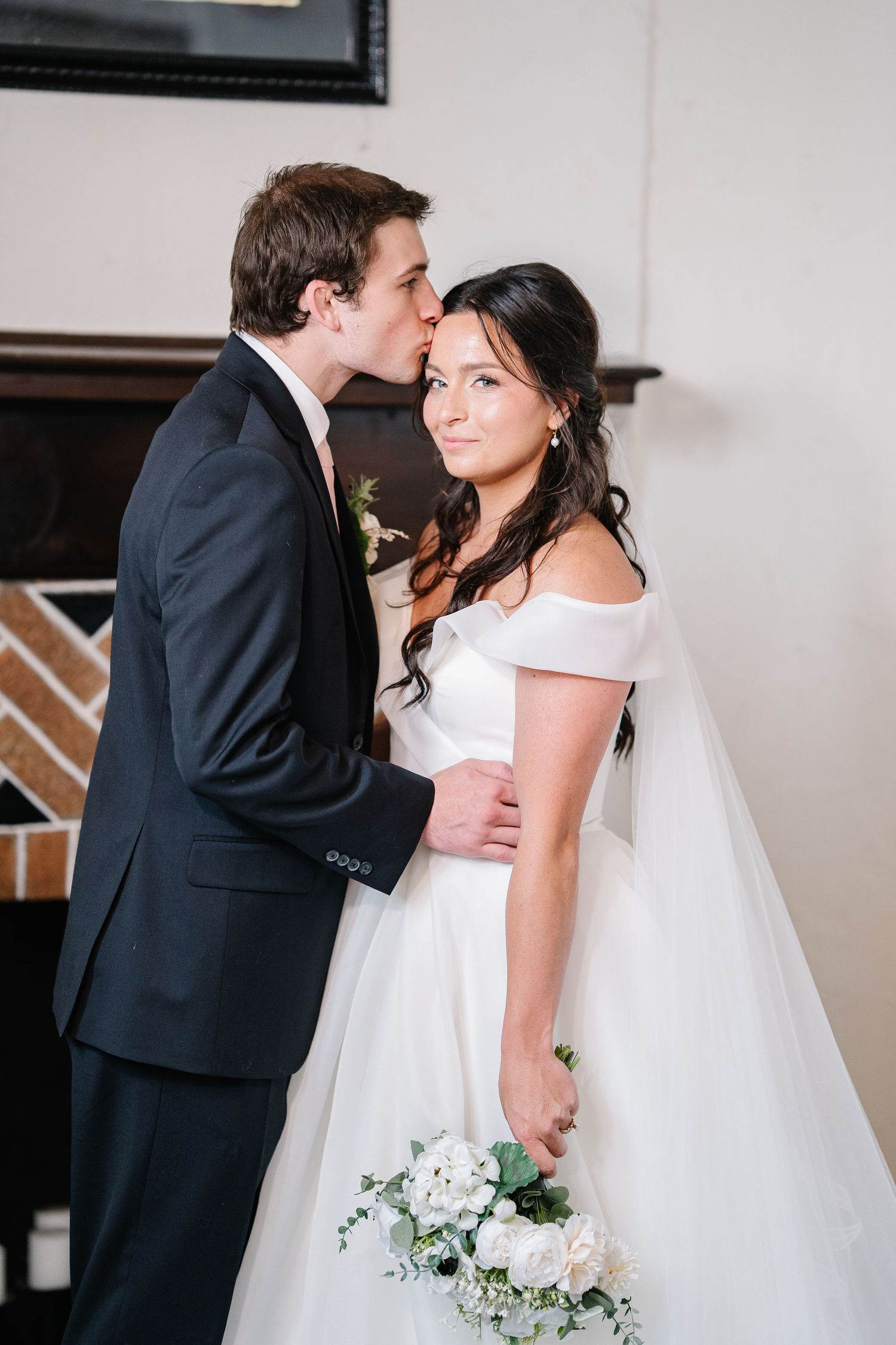 A romantic wedding sequence shows a couple in formal attire sharing tender moments with a white floral bouquet.