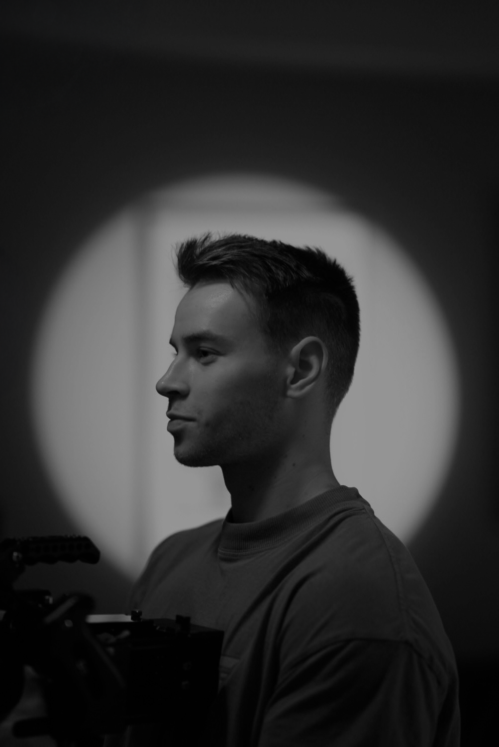 Artistic black and white portraits with dramatic lighting and shadow effects.