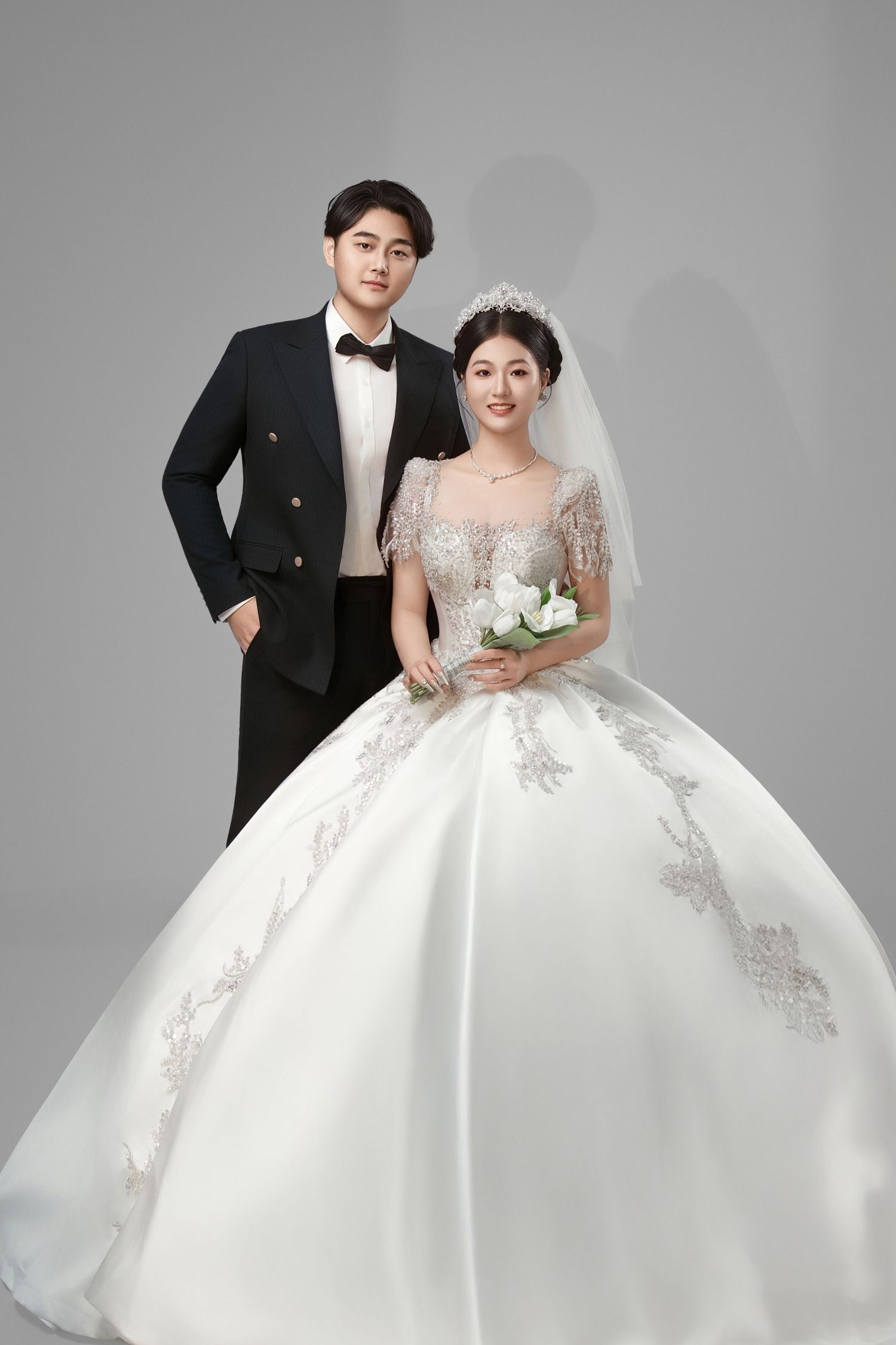 A wedding photography series showing a couple in formal attire against a gray studio backdrop.
