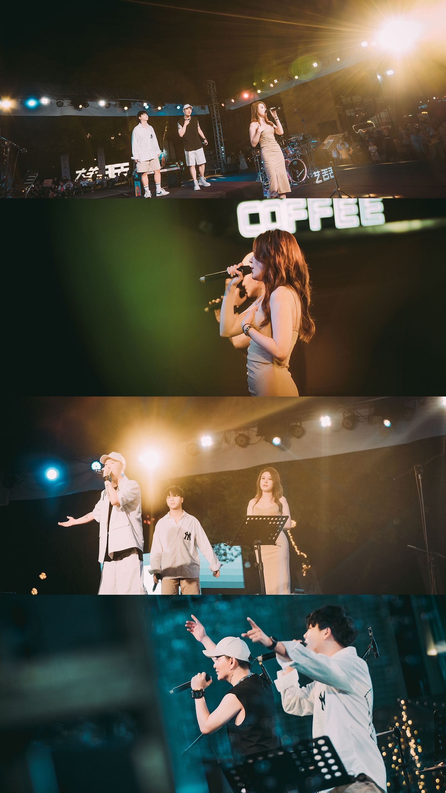 Performers singing on a lit outdoor stage at night during a live music concert event.