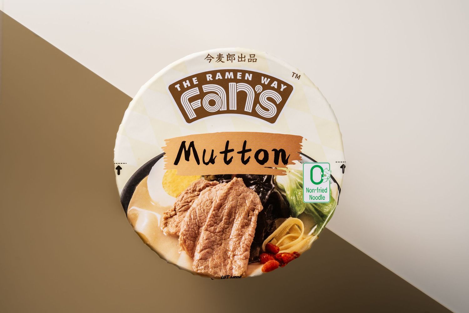 Fan's The Ramen Way Mutton flavored instant noodles in a round cup, featuring savory broth and tender meat imagery.
