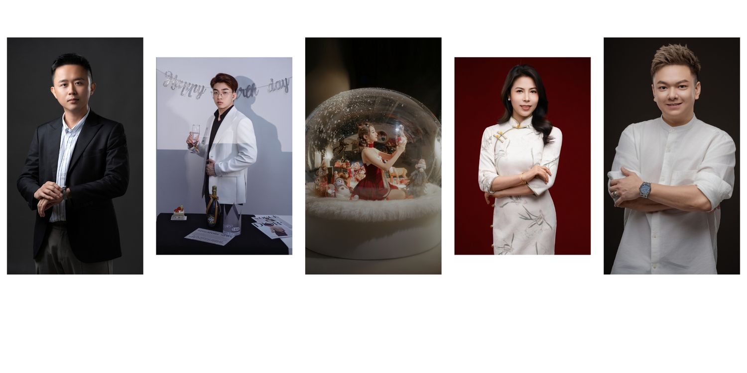 Five professional Asian individuals posing in formal attire, including a snow globe centerpiece, for elegant portrait photography.