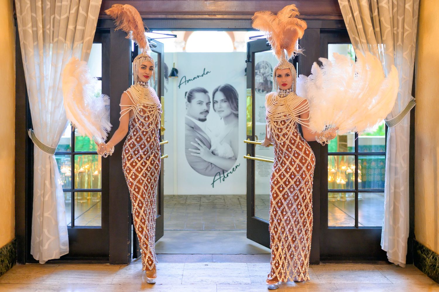 Glamorous showgirls flank the entrance, adding Old Hollywood flair to the celebration.