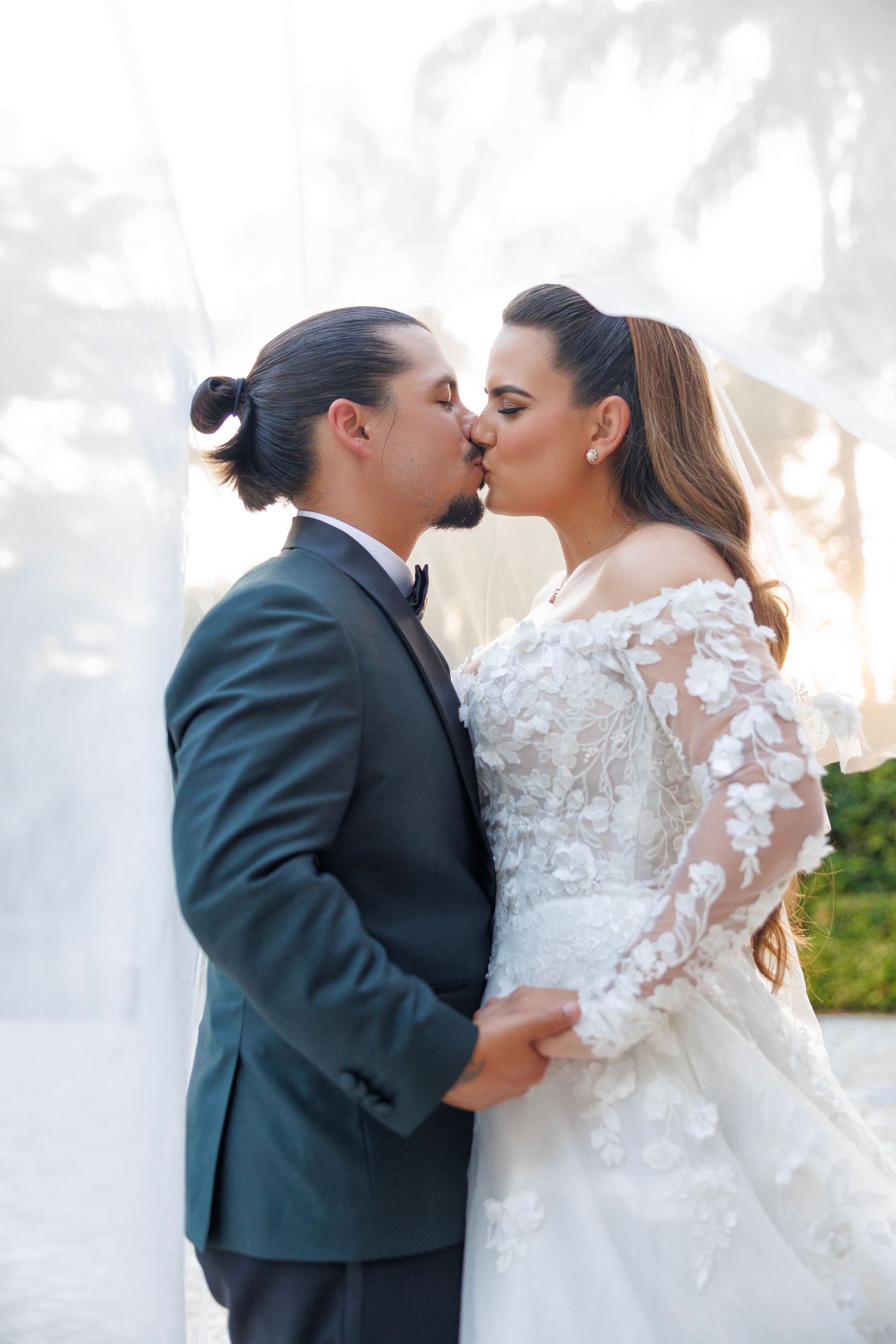 A romantic kiss captured just after saying “I do.”
