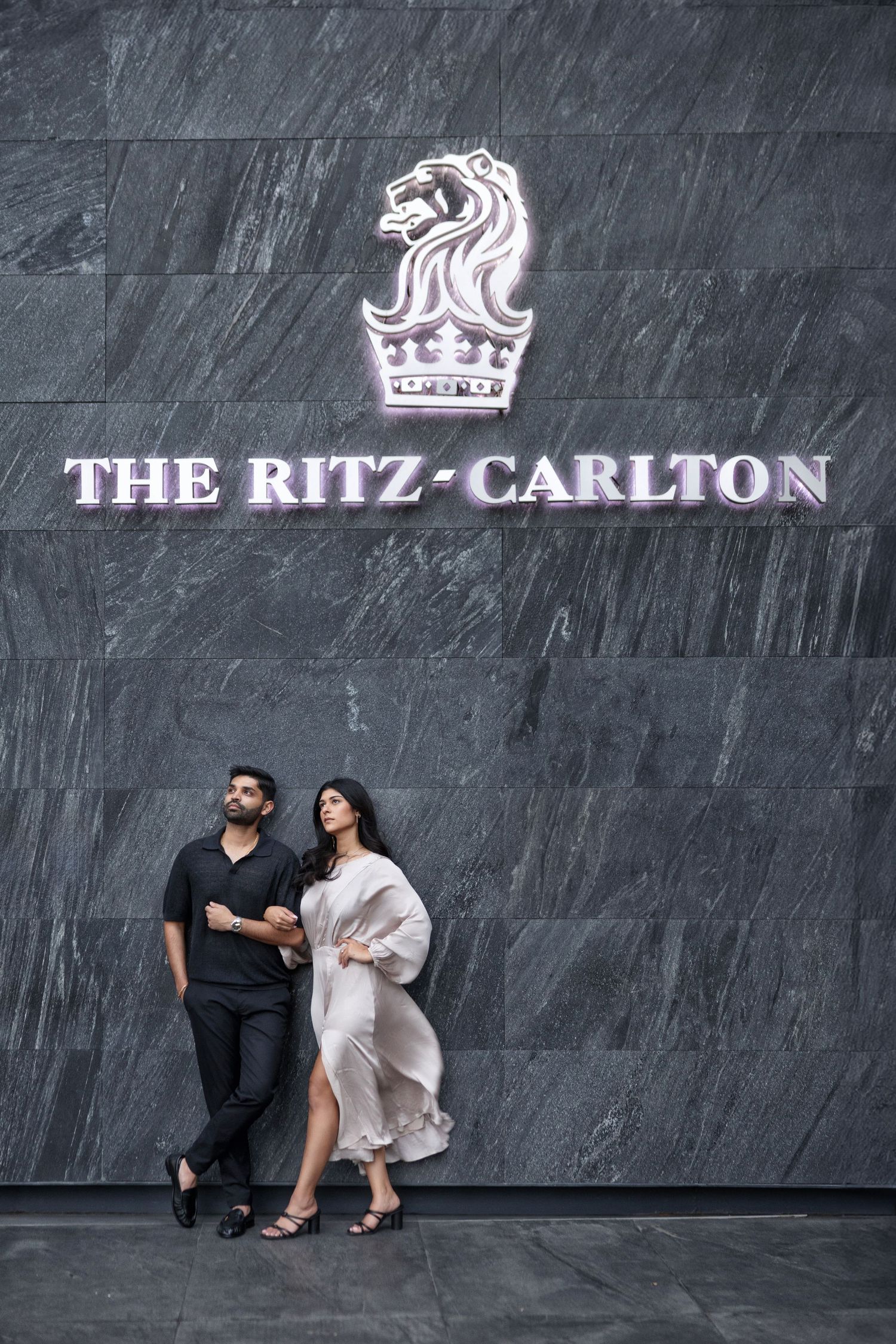 Bride and groom portrait in front of The Ritz-Carlton, Mexico City—refined editorial wedding photography.