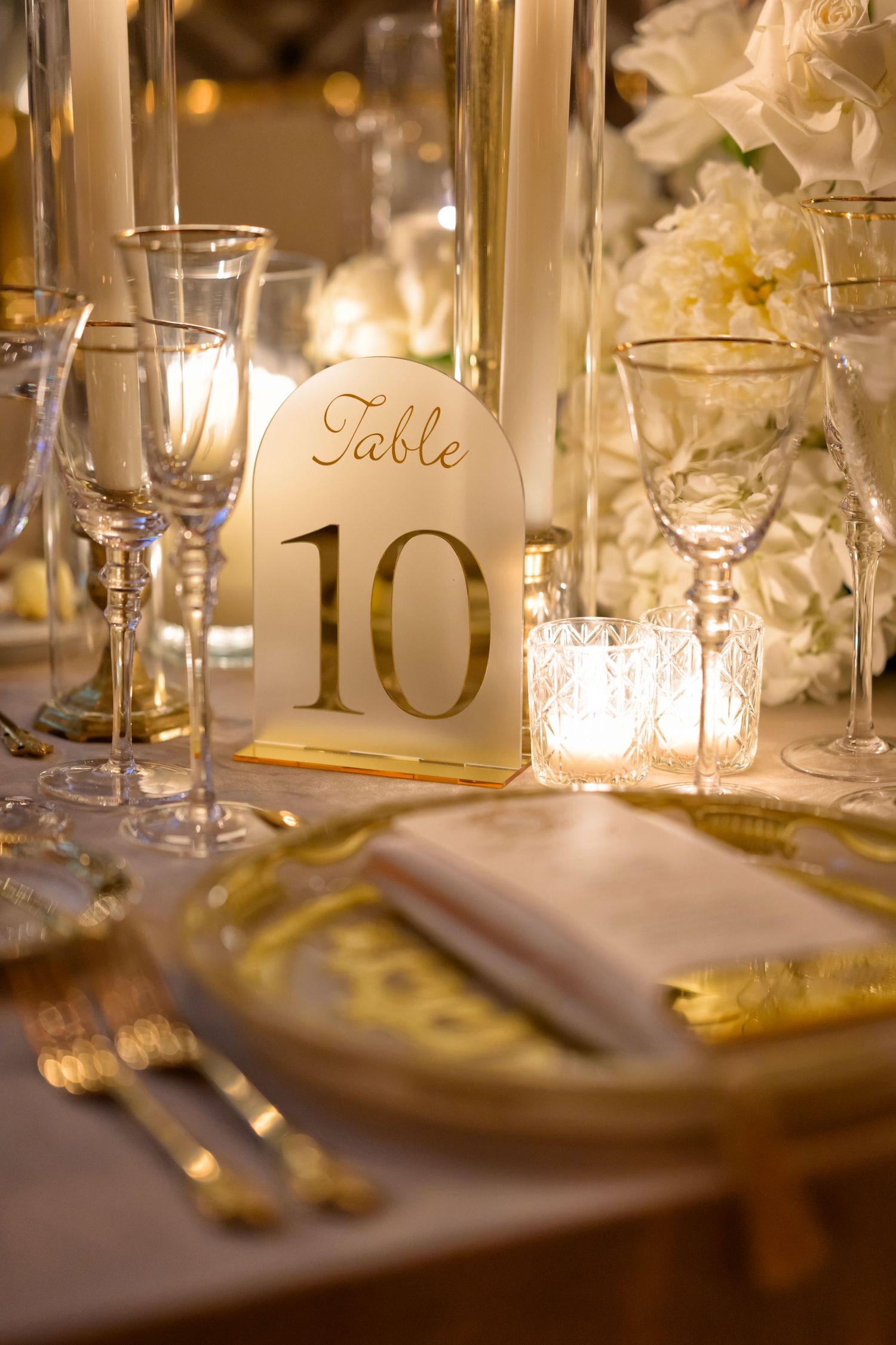 Golden table details with soft candlelight glow.