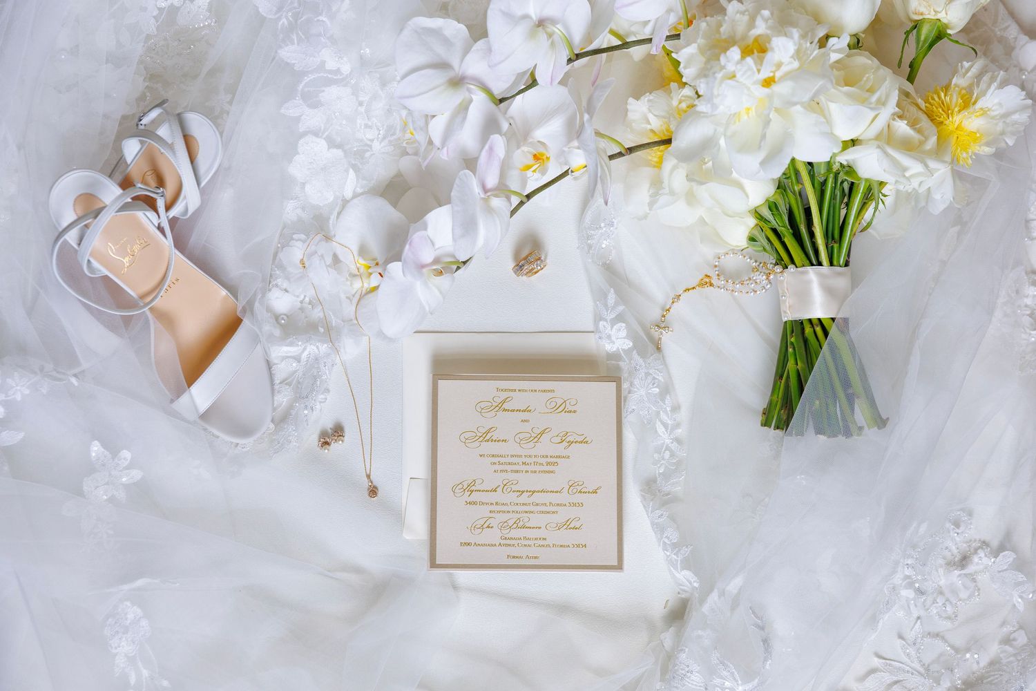 Elegant flatlay with invitation, shoes, and florals set the tone for a timeless celebration.