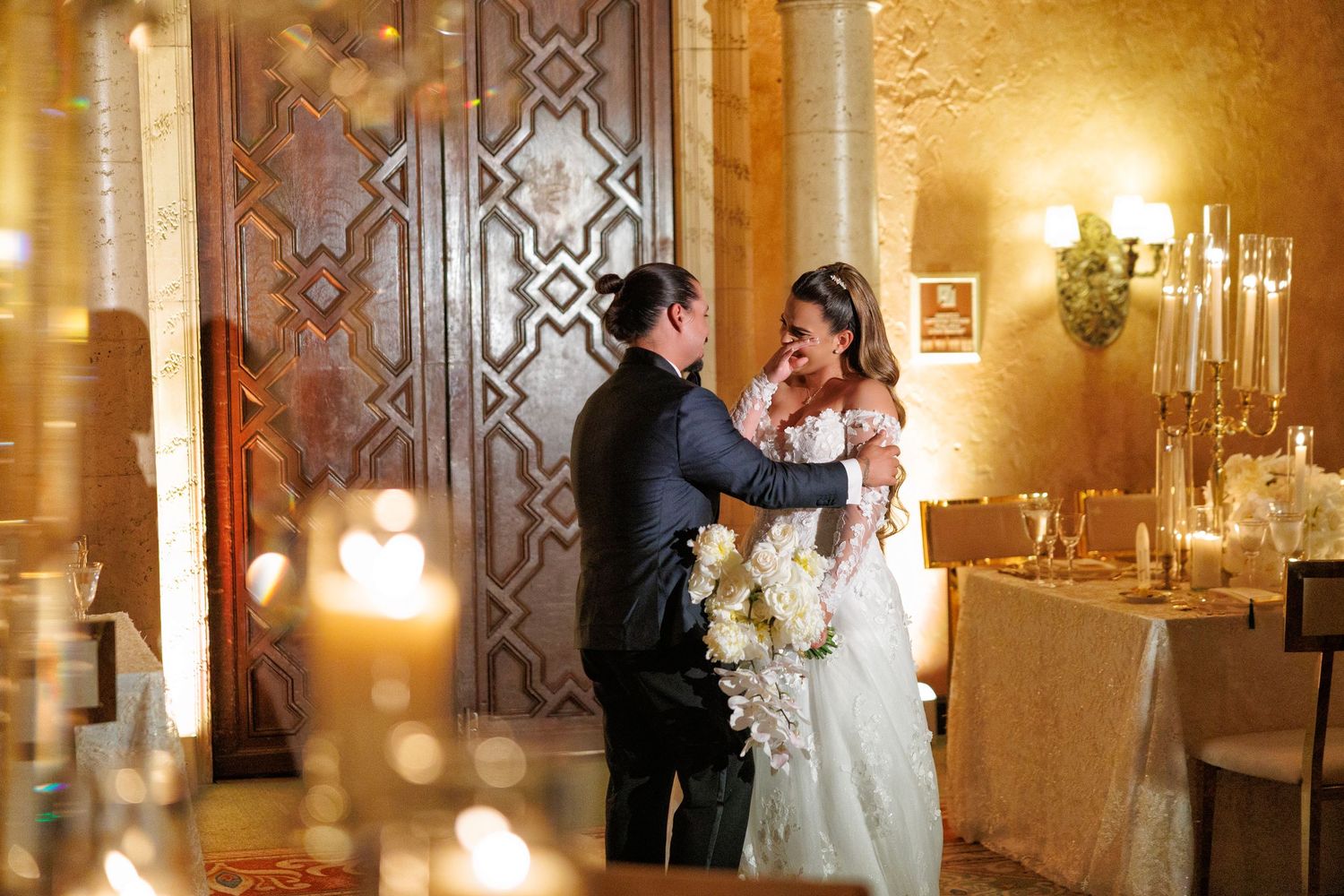 A romantic embrace as the couple shares their first moments as husband and wife.