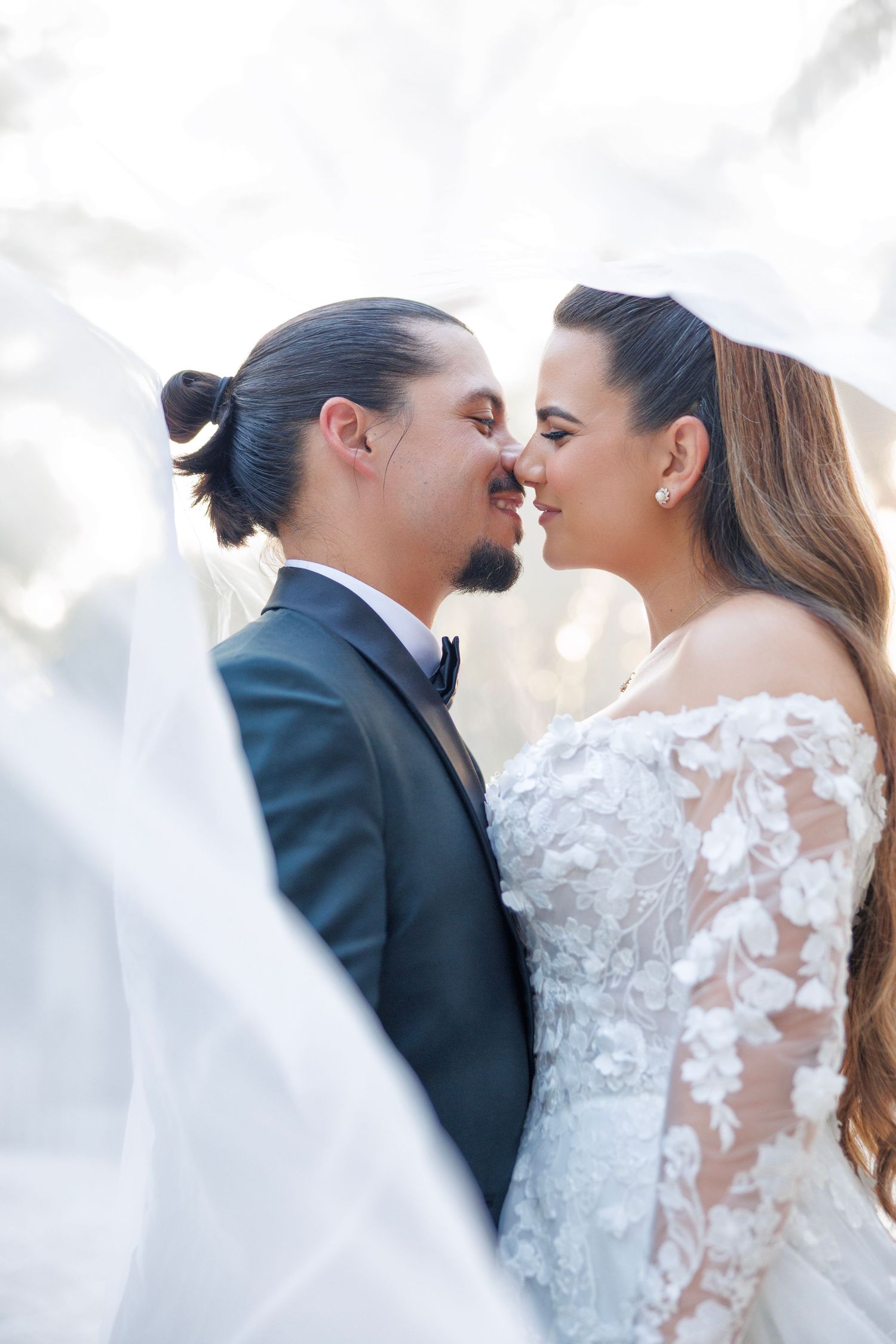 Romantic close-up of the couple gazing into each other’s eyes, full of joy.