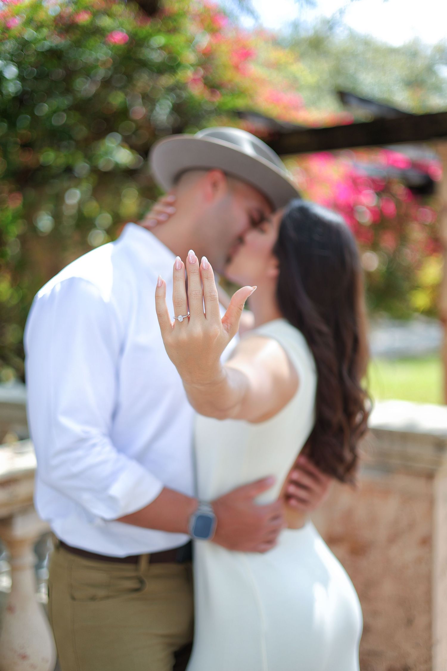 Romantic kiss during an engagement session in Miami—natural light and timeless direction.
