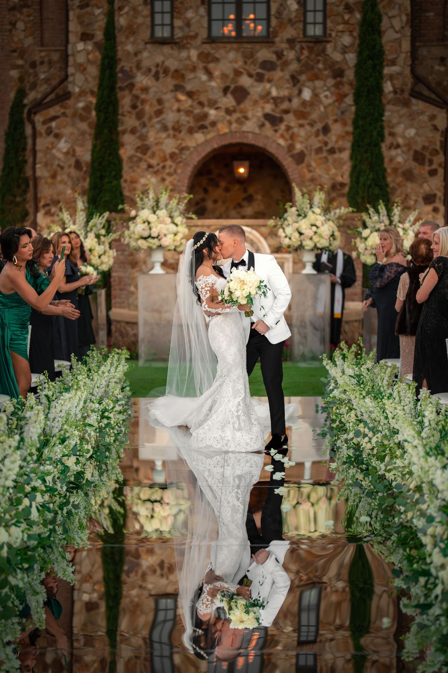 Luxury wedding ceremony in a grand church—bride and groom exchanging vows under ornate arches.