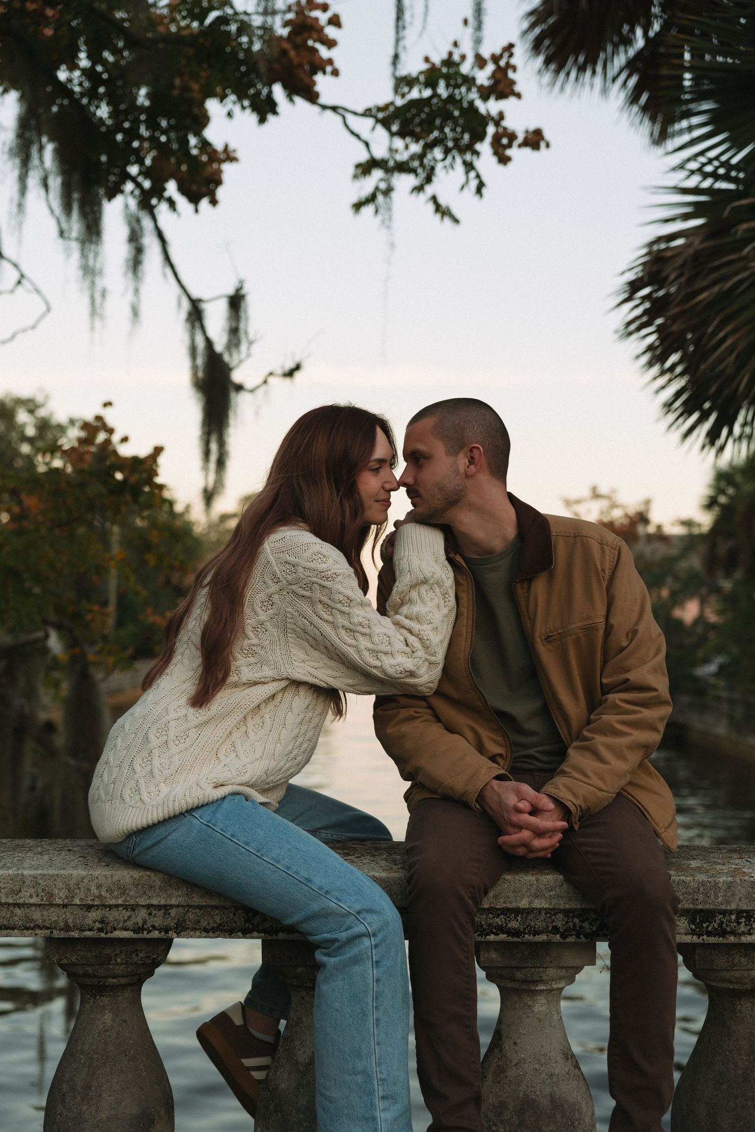 Couple sitting together in Riverside Jacksonville during a sunset session