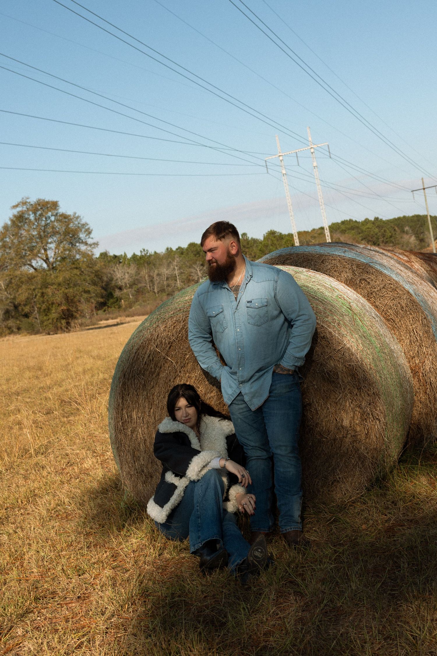 Couple embracing during a romantic photoshoot on a Florida farm