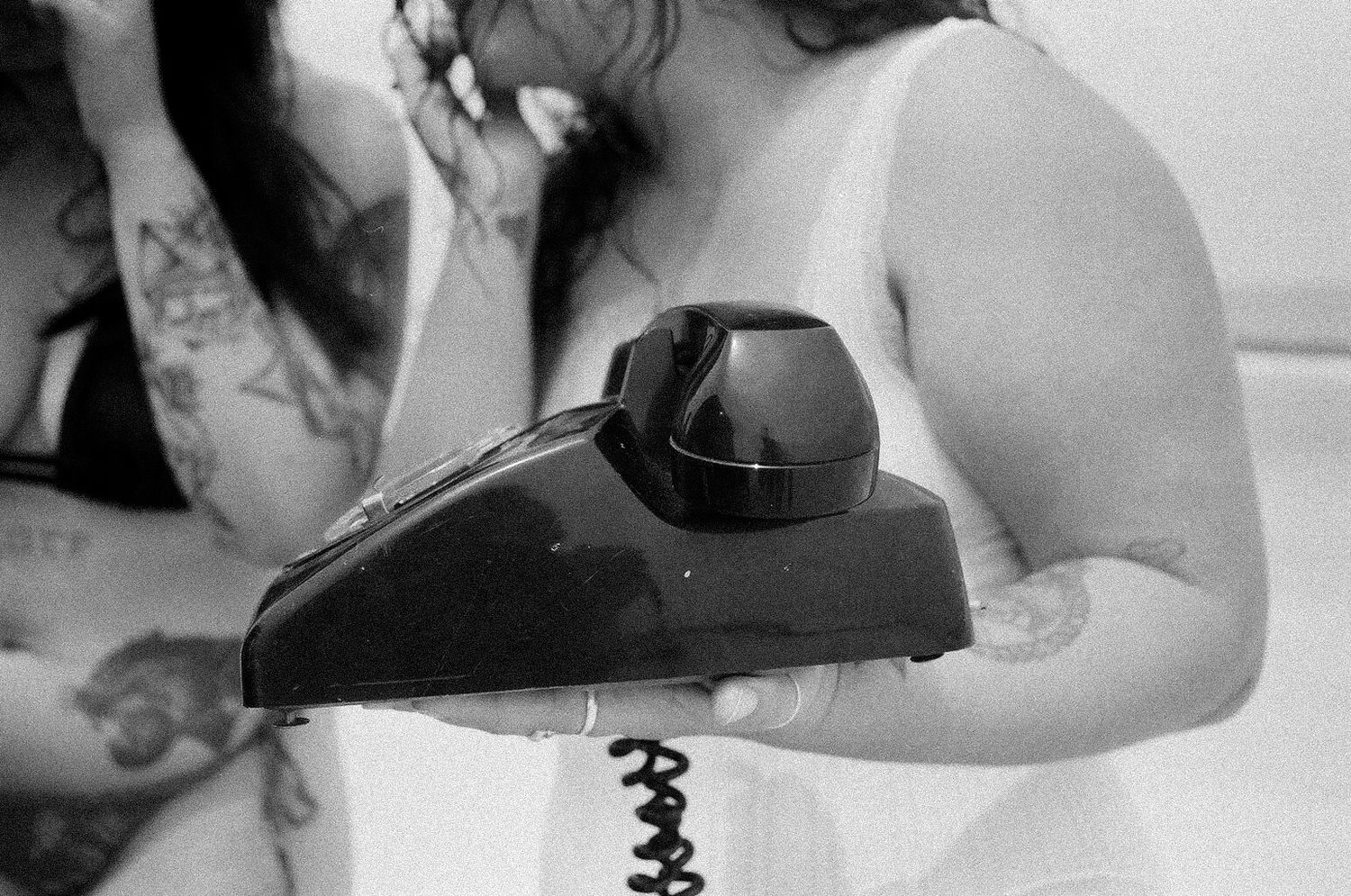 black and white film photo of vintage telephone