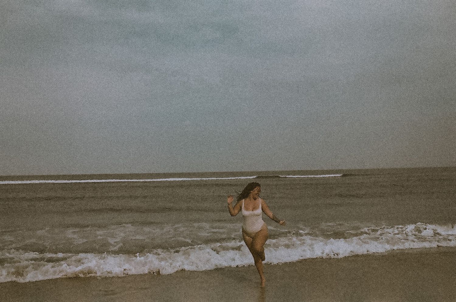 Film portrait photo dancing beachside