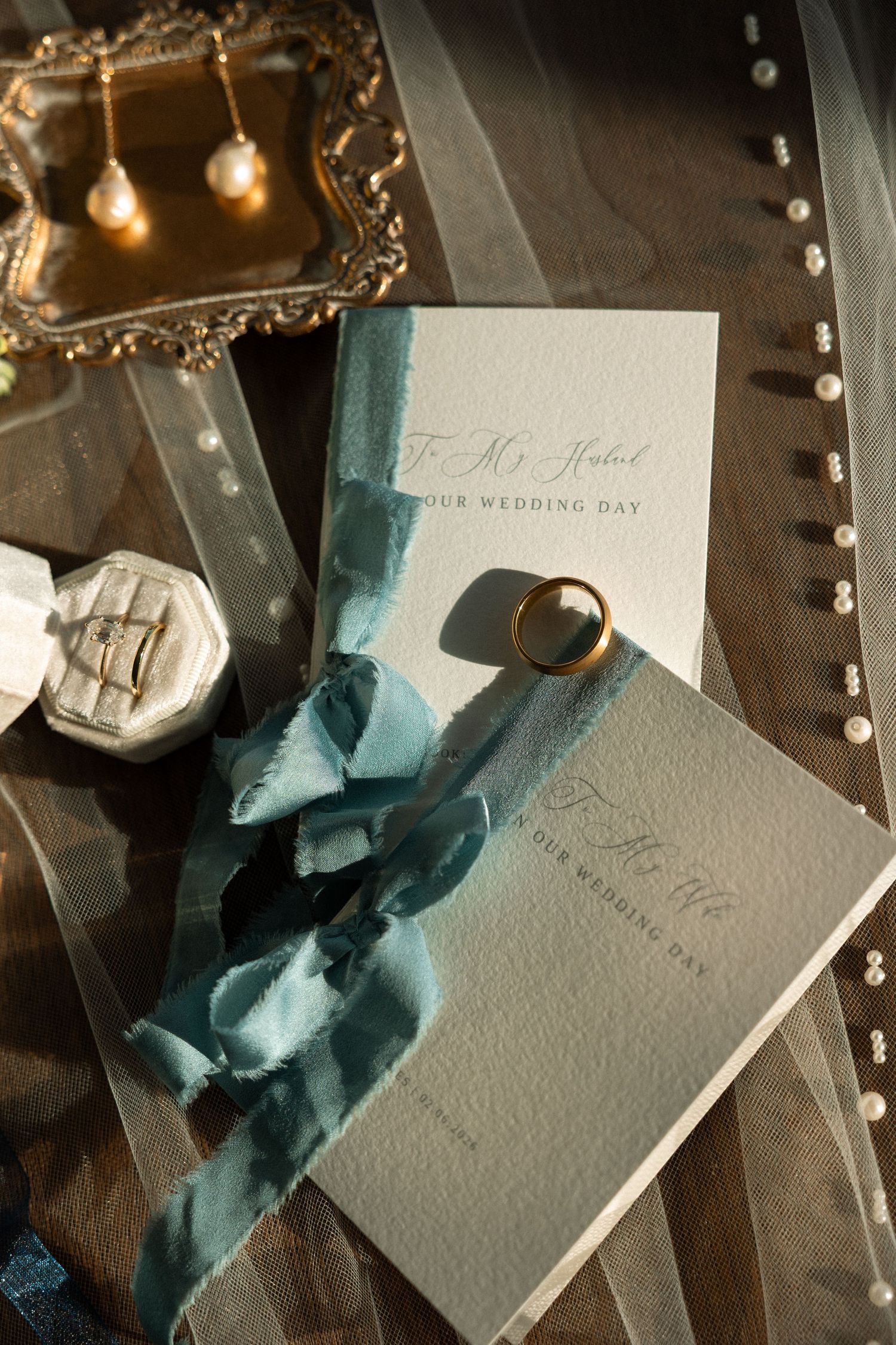 Invitation suite and wedding rings from an intimate beach elopement