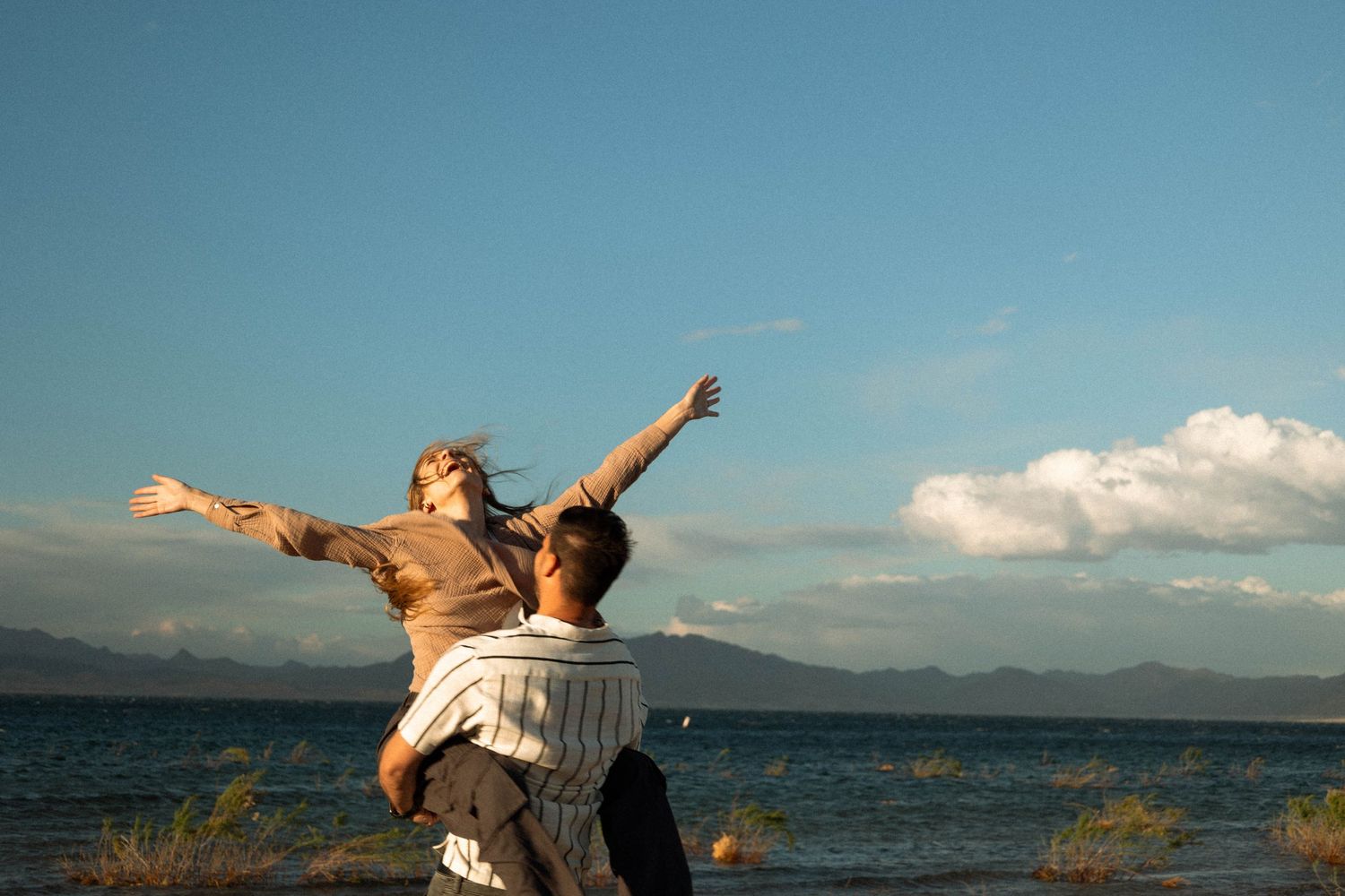 couple playing by the water at lake mead in Las Vegas Nevada