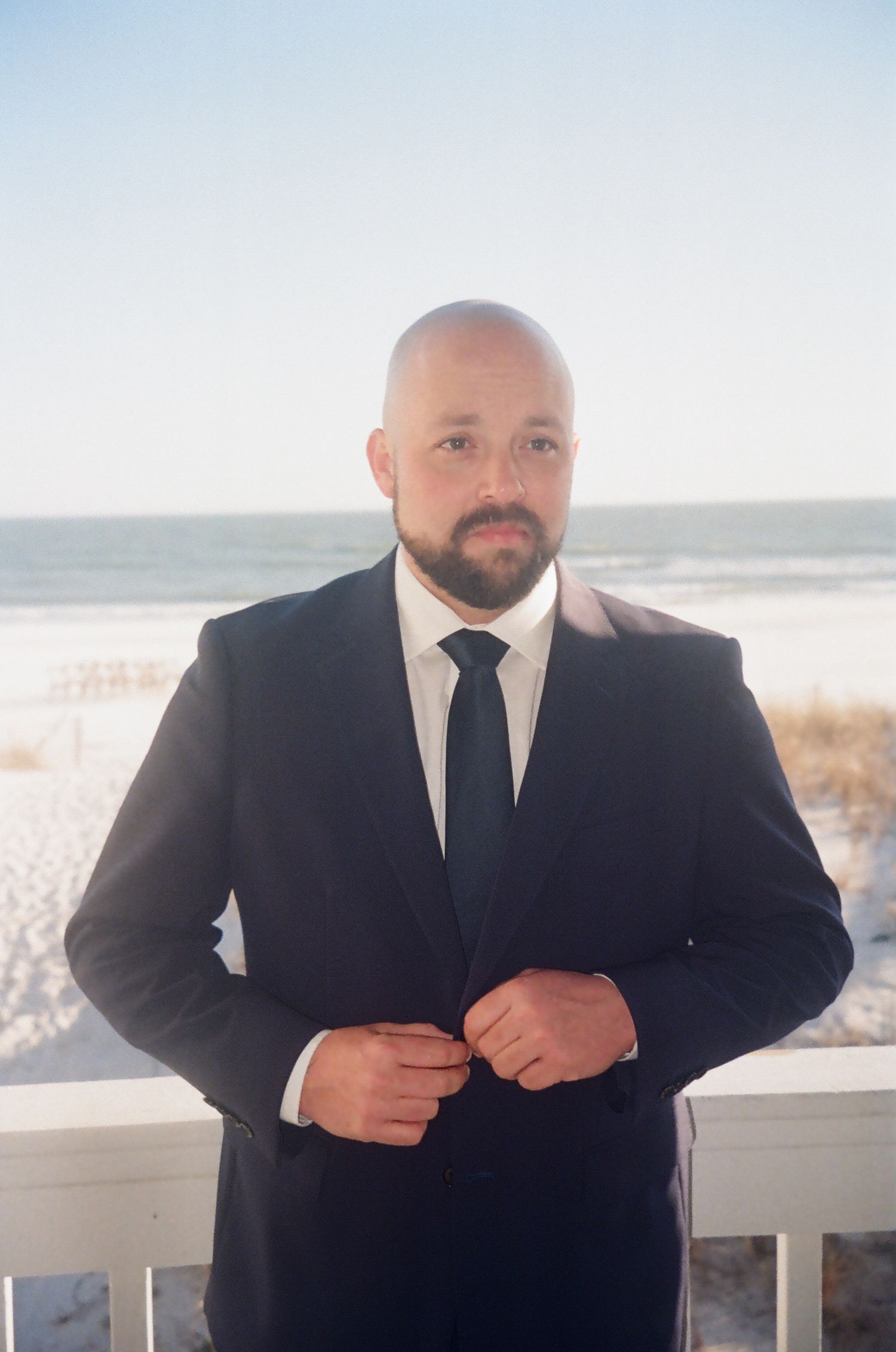 35mm film portrait of a groom during a beach elopement