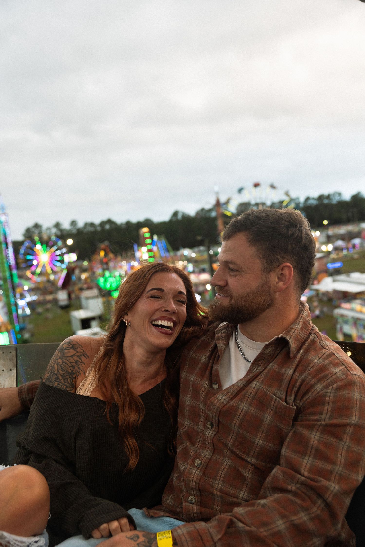 Fairground couples session featuring rides and candid moments