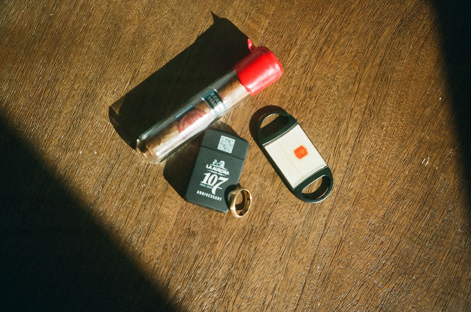 Groom's wedding details featuring shoes, accessories, and personal items