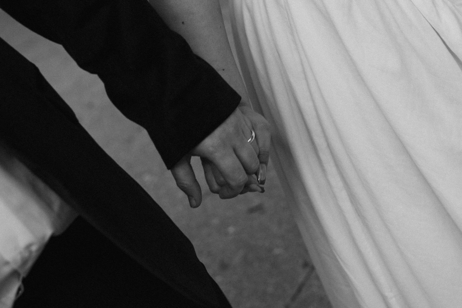 Couples holding hands during elopement
