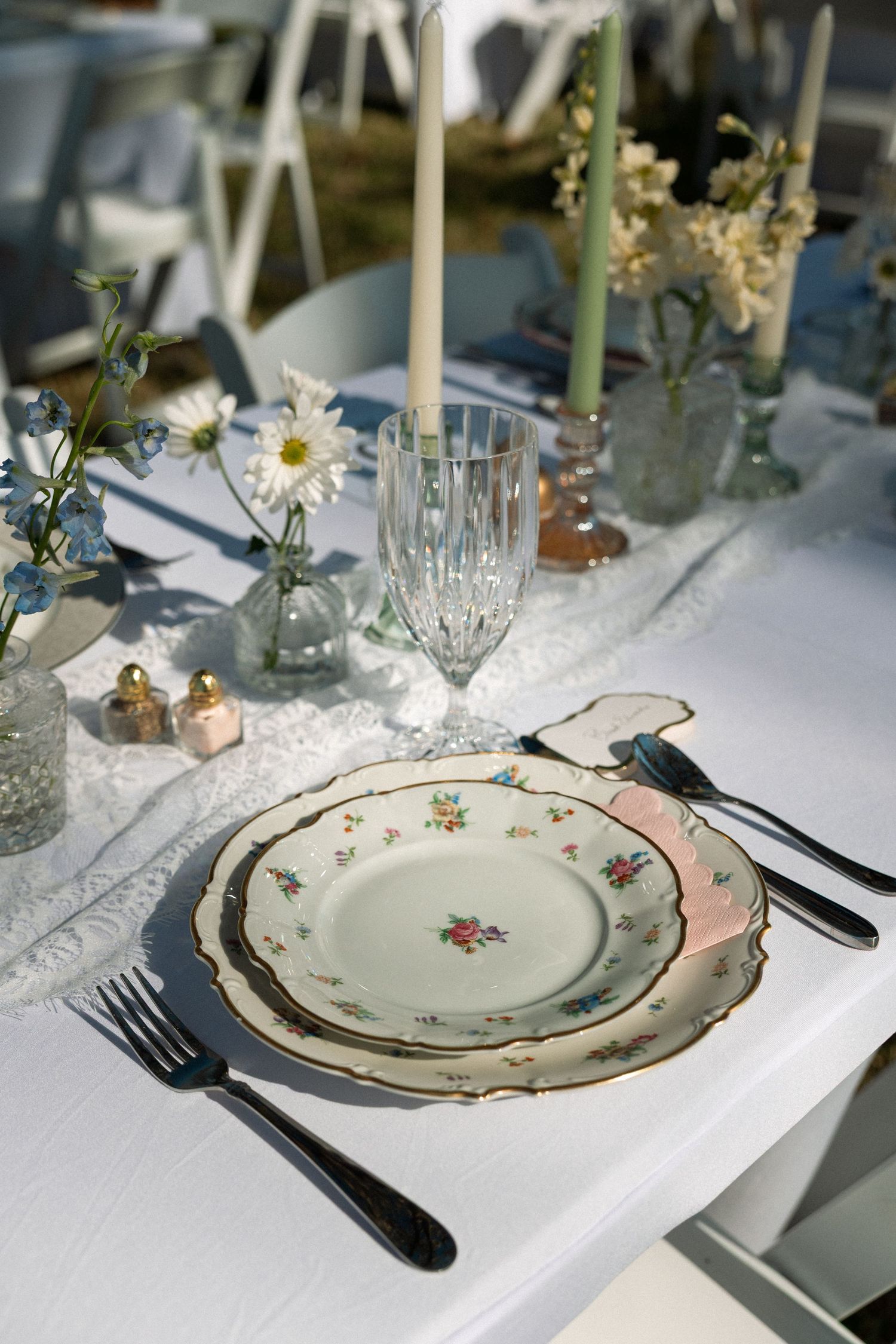 Elegant wedding table setting featuring plates and reception details