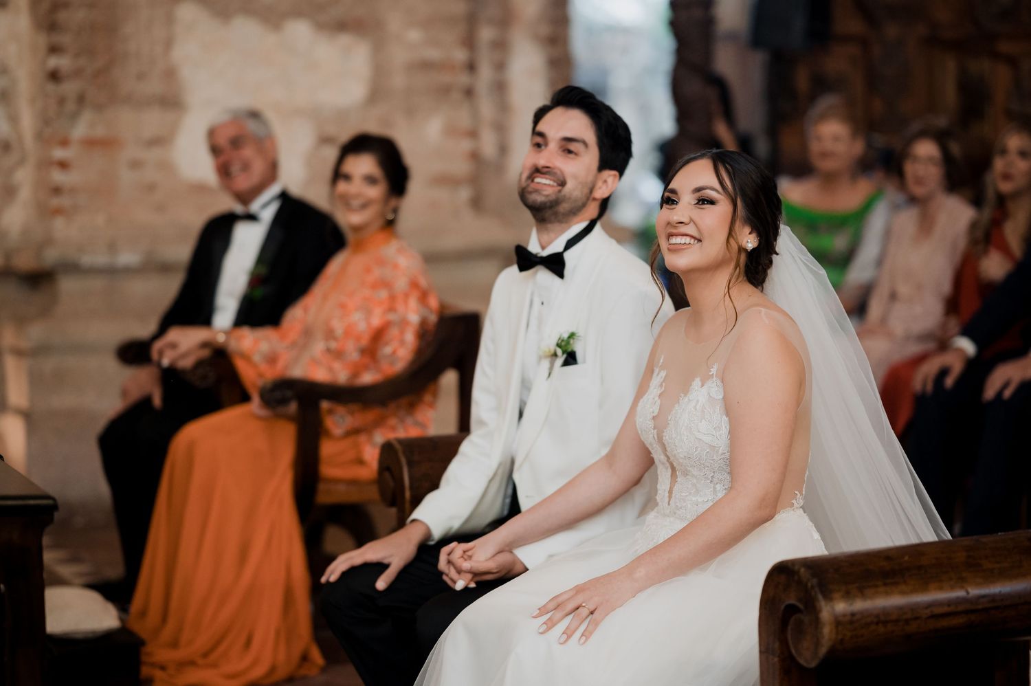 A joyful moment during a wedding ceremony in a historic brick church.