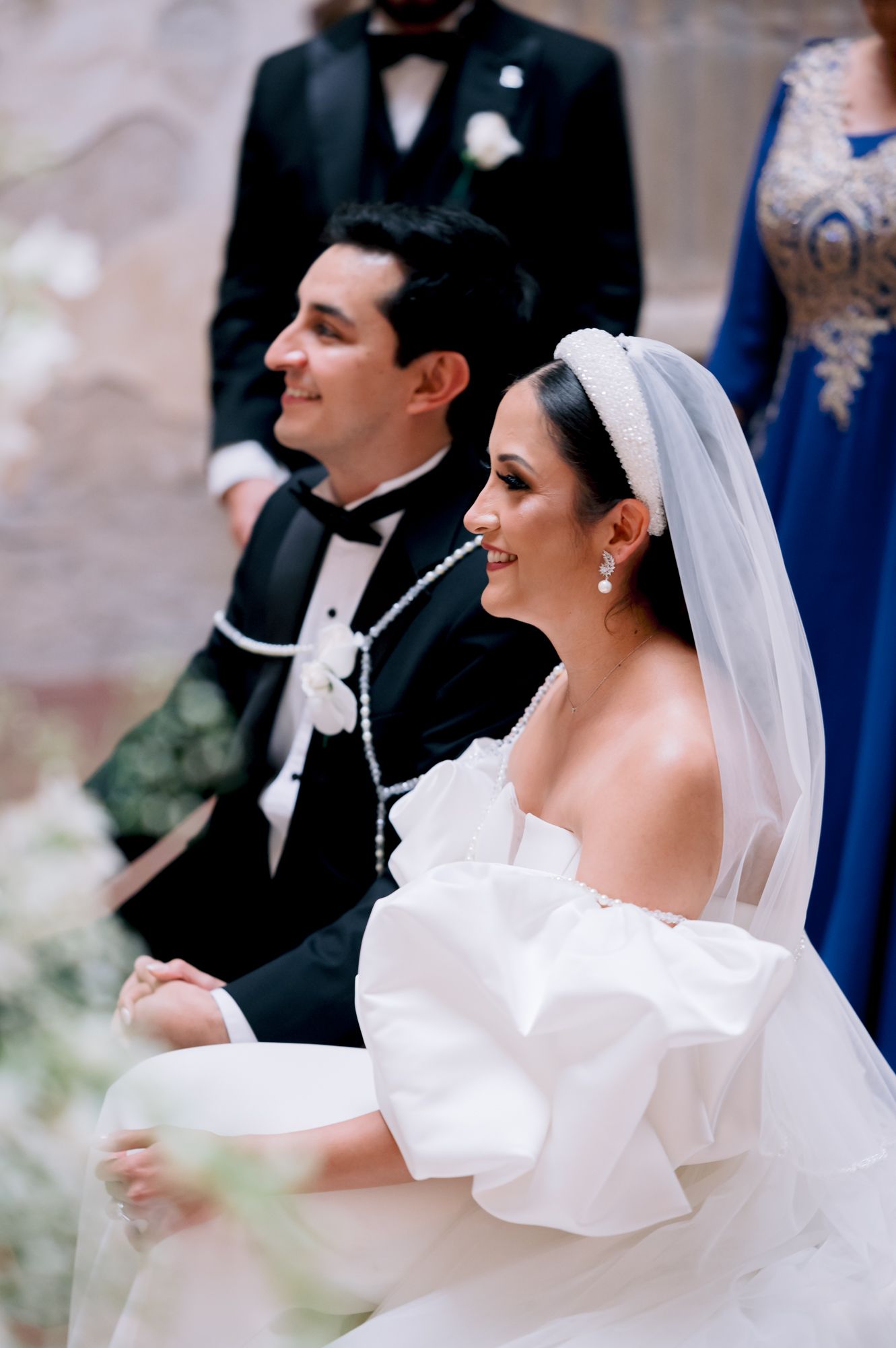 Newlyweds share a joyful moment during their wedding ceremony.