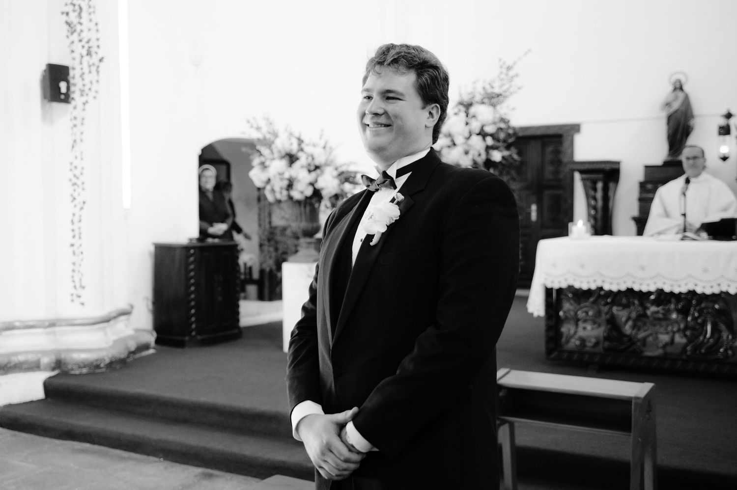 Black and white photograph of a formal event in a church sanctuary.