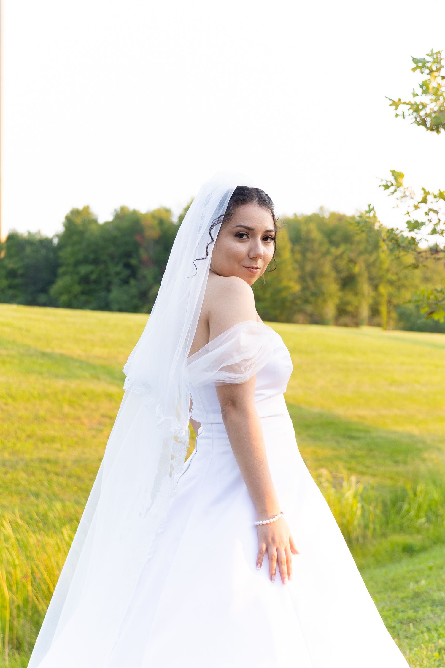 A bride looking over her shoulder on her wedding day