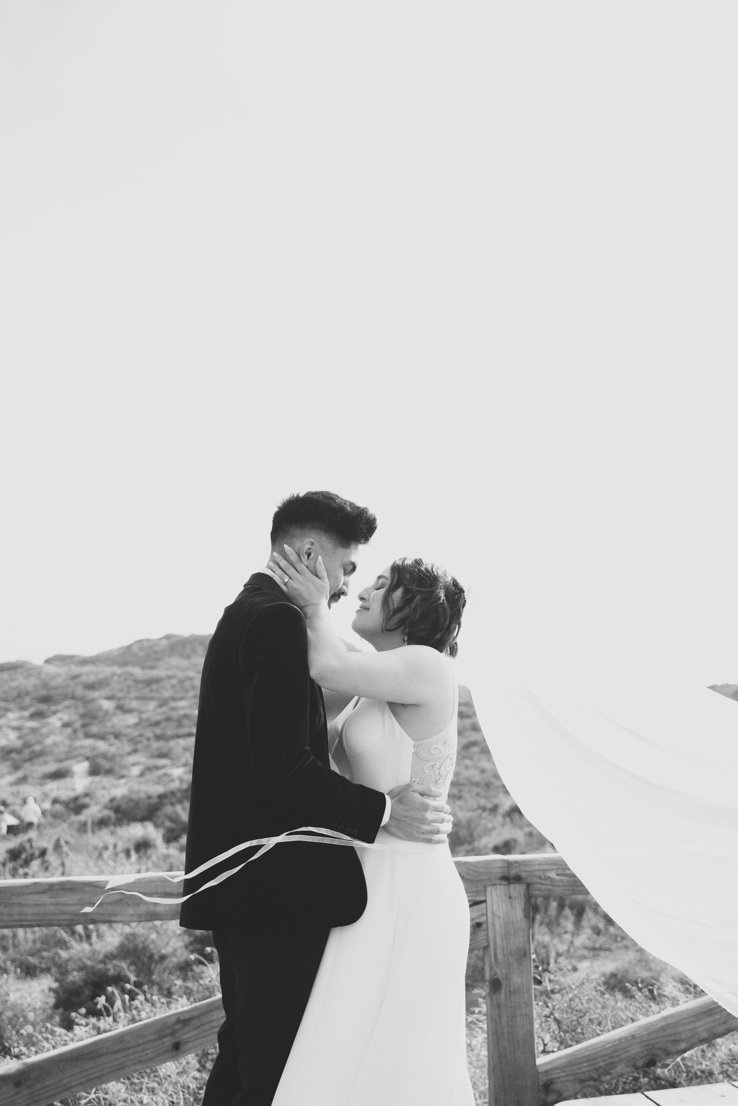 Bride and groom kissing on their wedding day at their malibu beach wedding