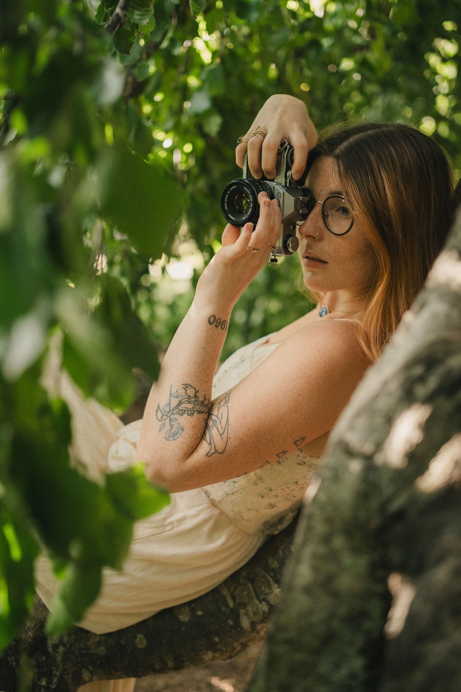 Kaitlyn Yvette Newfoundland Wedding Photographer with film camera
