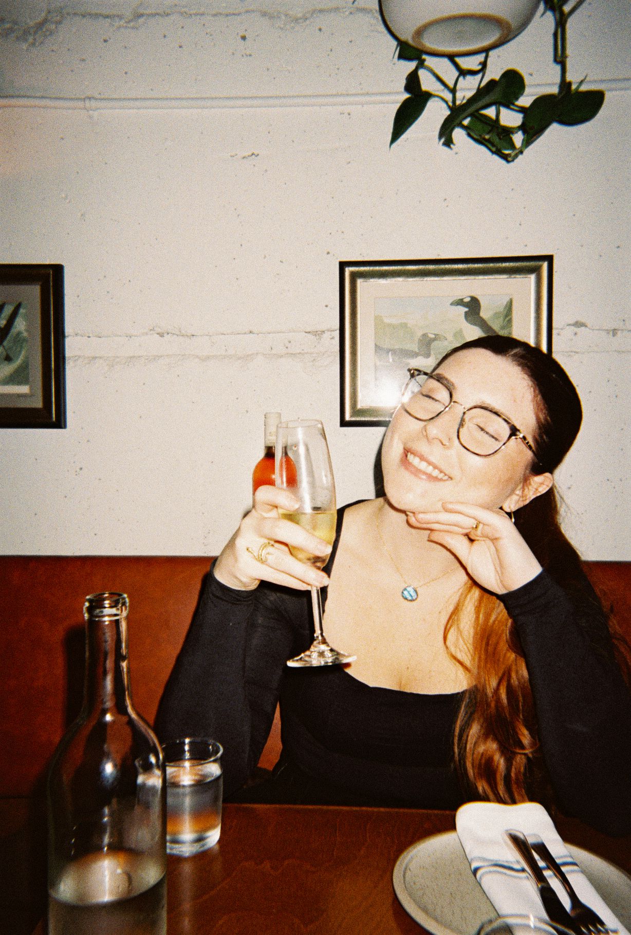 Newfoundland Wedding Photographer Kaitlyn Yvette holding a glass in cheers, captured on film by her second photographer