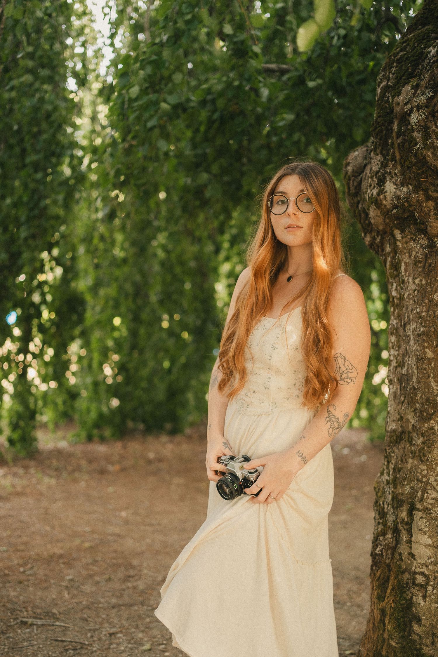 Kaitlyn Yvette Newfoundland Wedding Photographer with film camera