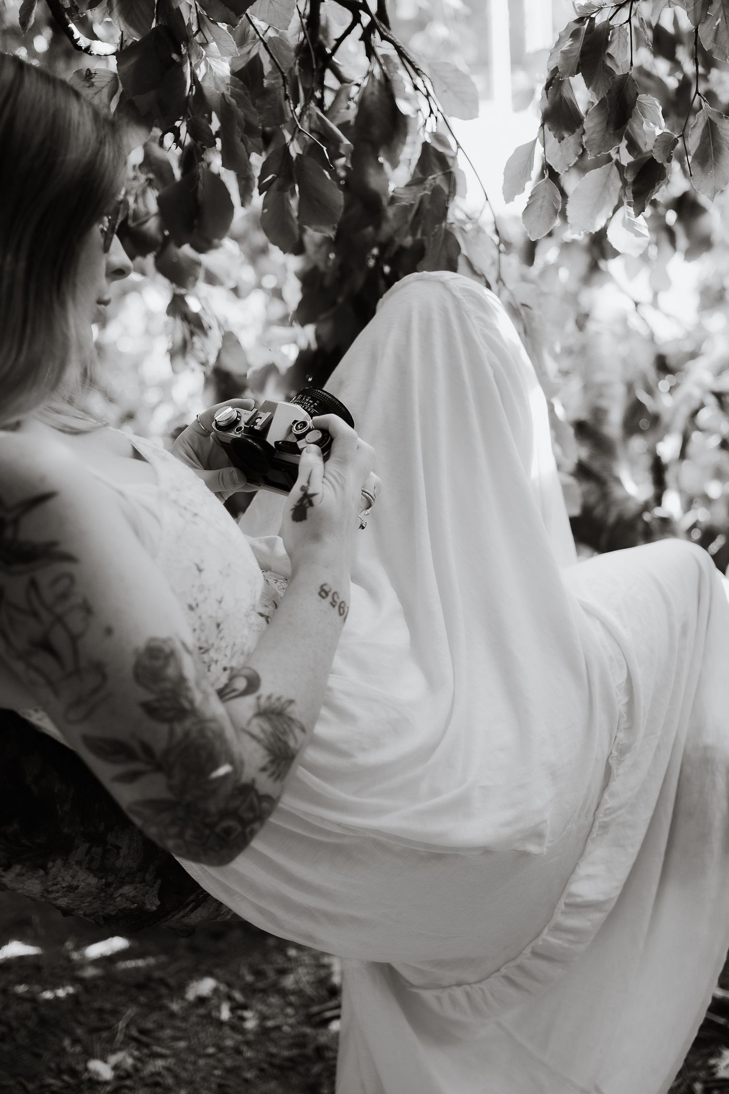 Kaitlyn Yvette Newfoundland Wedding Photographer with film camera