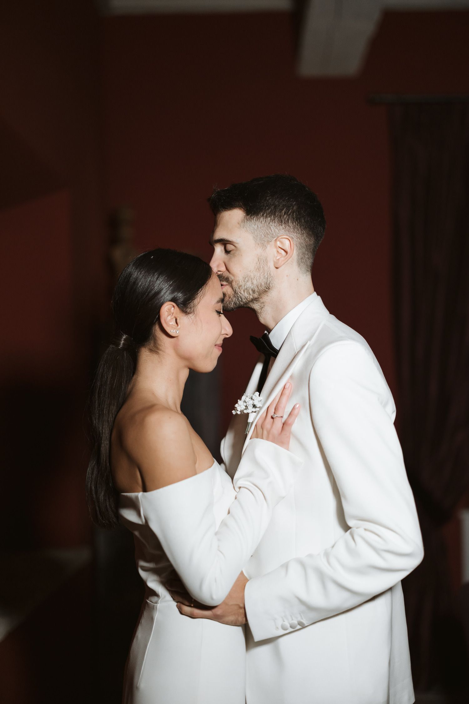 Bride and groom embracing during an elegant winter wedding at Podere Tesoro in Tuscany.