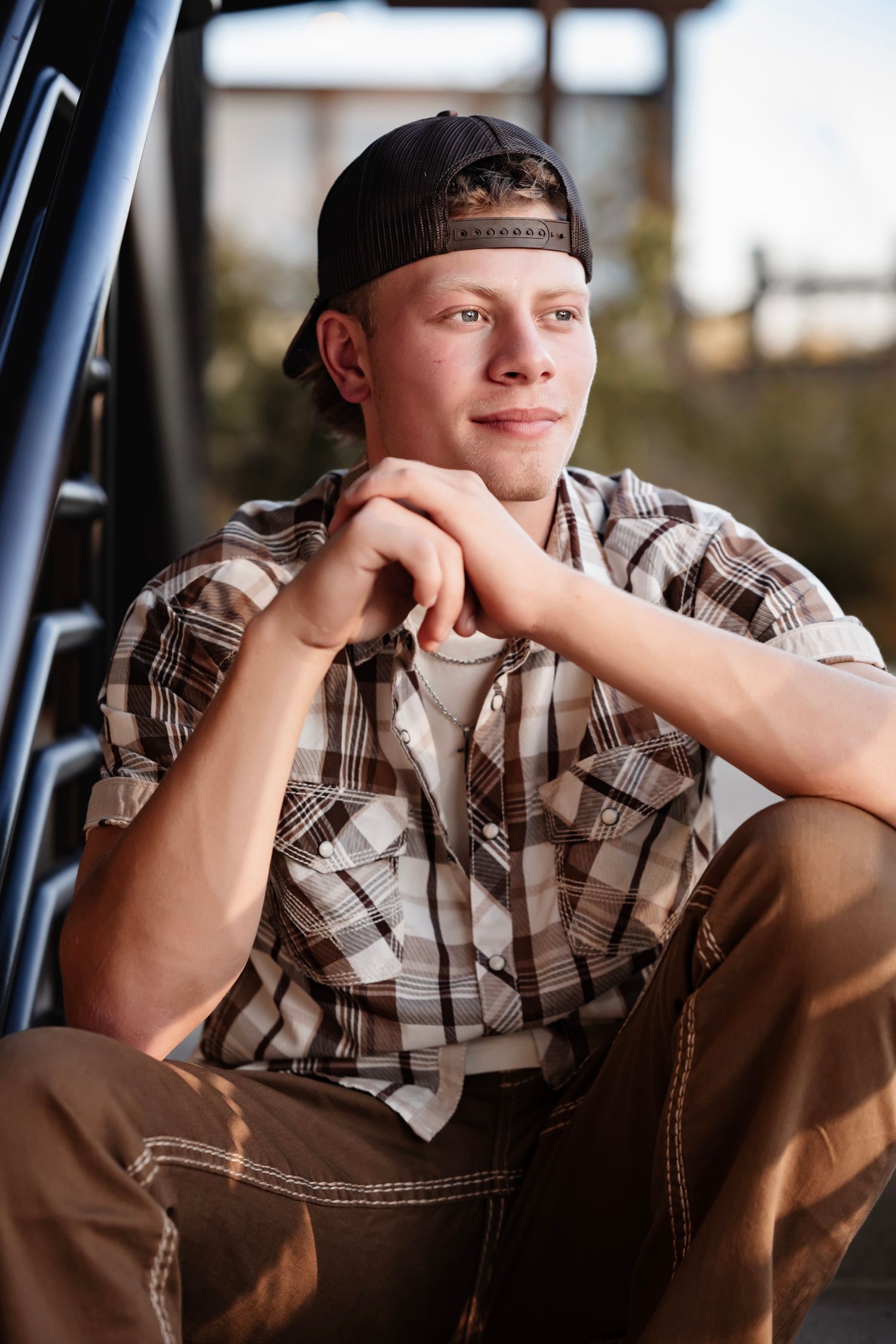 A series of five similar photos showing someone wearing a plaid shirt and baseball cap in a thoughtful pose.