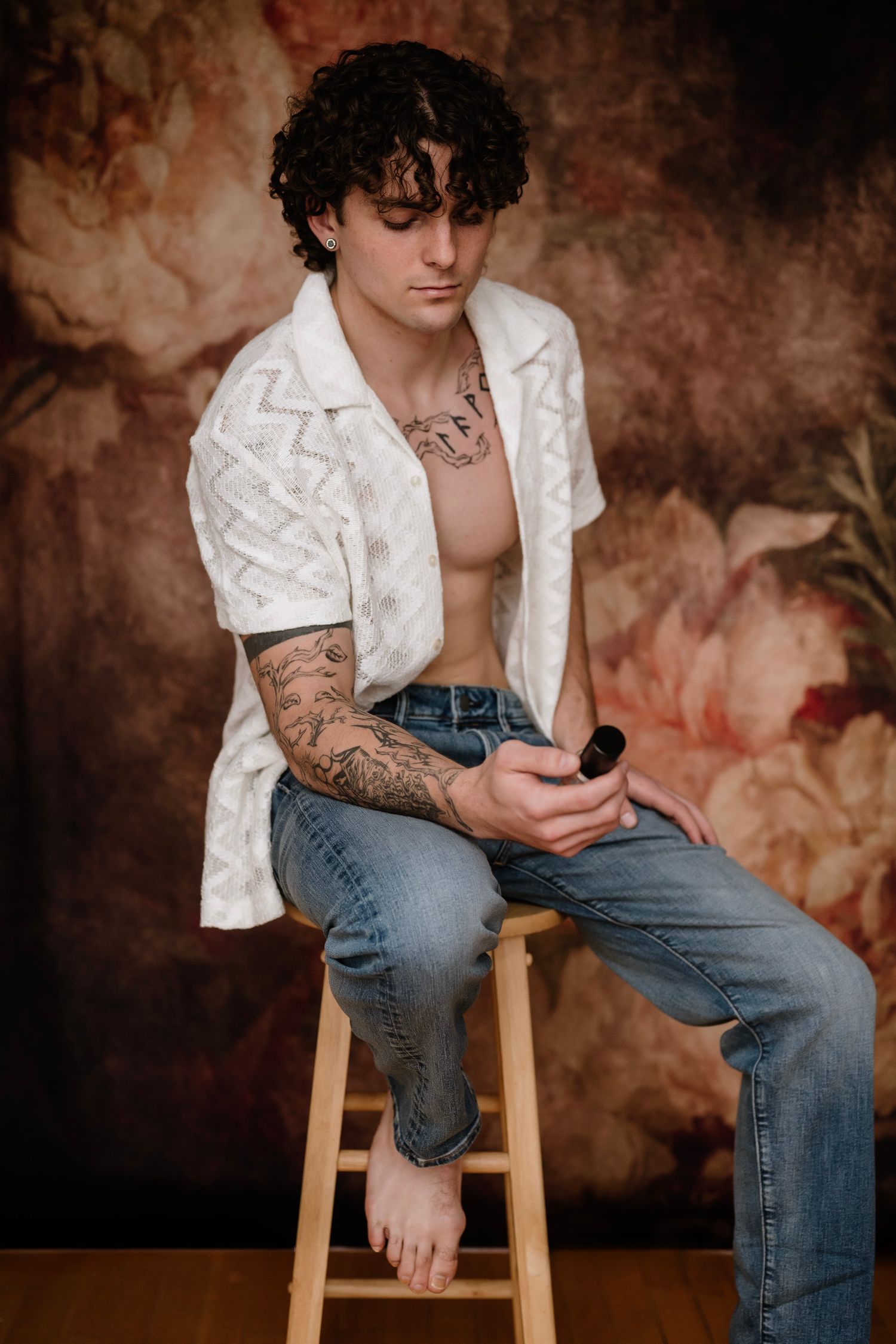 Artistic portrait series showing person in white shirt and jeans sitting on wooden stool against textured brown backdrop.