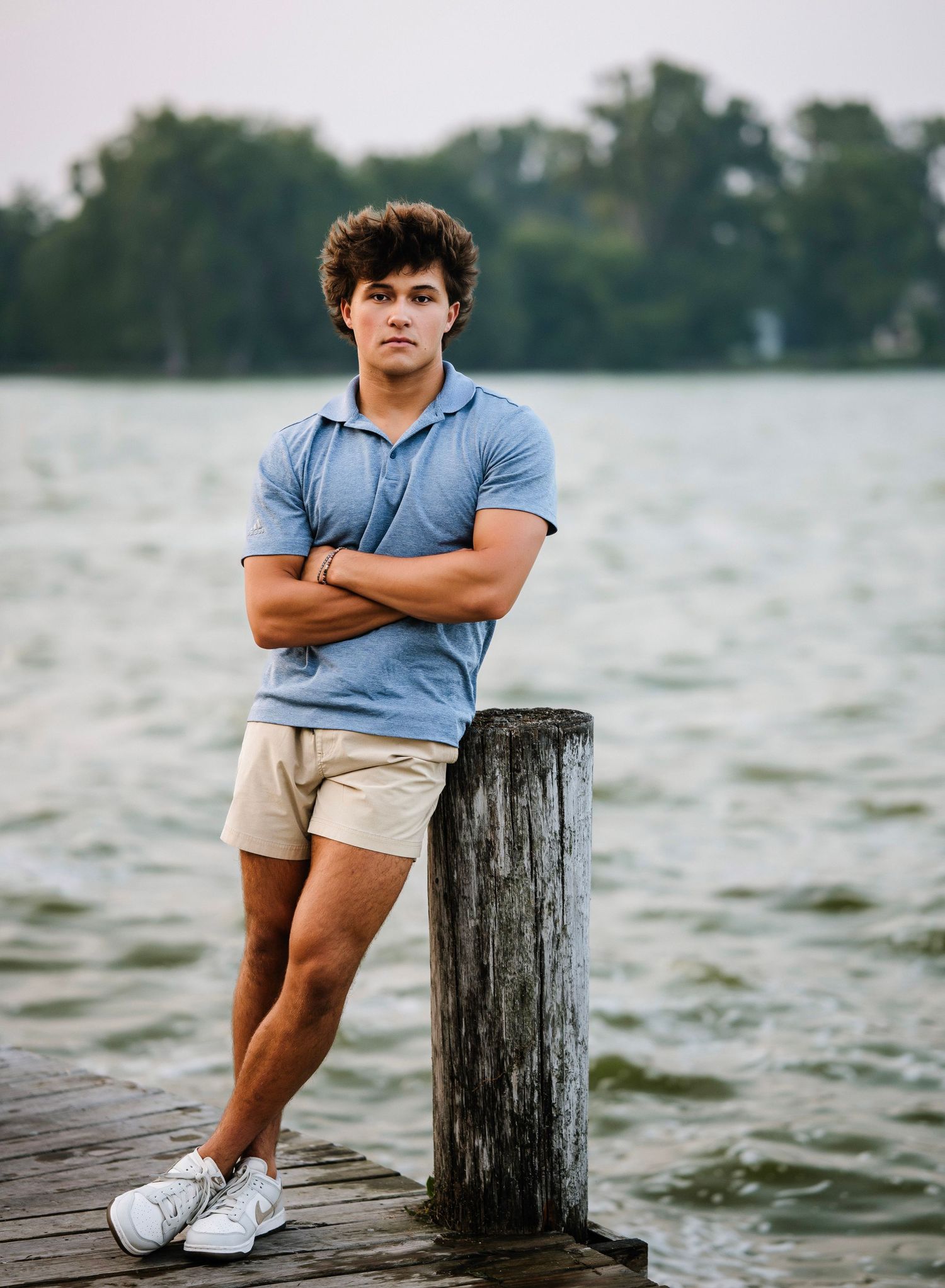 A series of casual outdoor portraits taken on a wooden dock by a lake during overcast weather.