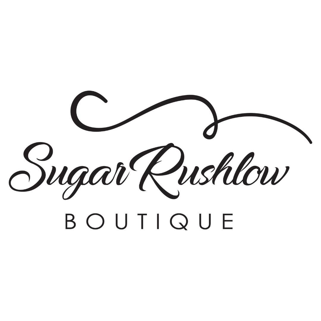 Black and white logo for Sugar Rushlow Boutique with elegant script font and decorative swirl design.